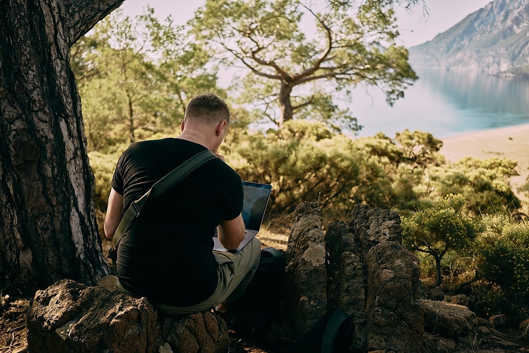 Hiker reviewing a digital trail map page in Cyprus